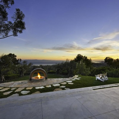 This is an example of a contemporary backyard landscaping in Santa Barbara with a fire pit.