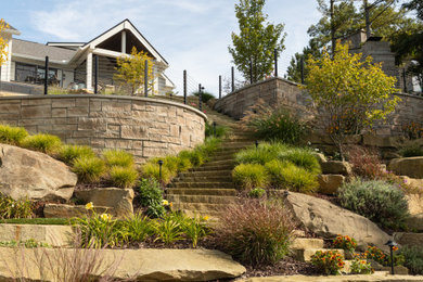 Inspiration for a backyard stone landscaping in Detroit.