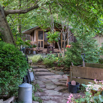 The pavilion is a retreat from ongoing gardening work.
