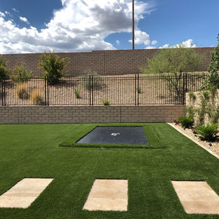 Inspiration for a large mediterranean full sun backyard stone outdoor playset in Las Vegas.