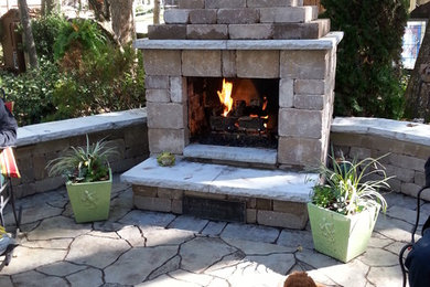Patio - large traditional backyard concrete paver patio idea in Raleigh with a fire pit