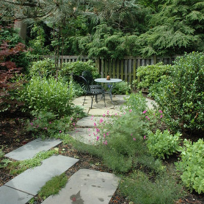 Design ideas for a traditional backyard stone landscaping in Boston.