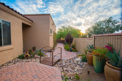 Design ideas for a mid-sized southwestern drought-tolerant, partial sun and desert side yard brick landscaping in Phoenix.