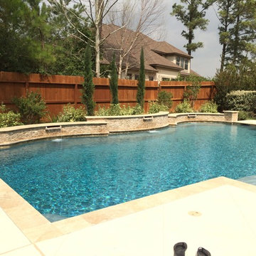 Travertine Pool with Raised Beam Wall & Scuppers