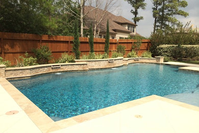 Hot tub - mid-sized traditional backyard concrete and custom-shaped hot tub idea in Houston