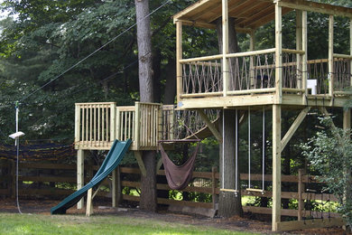 Inspiration for a large traditional backyard brick outdoor playset in New York.