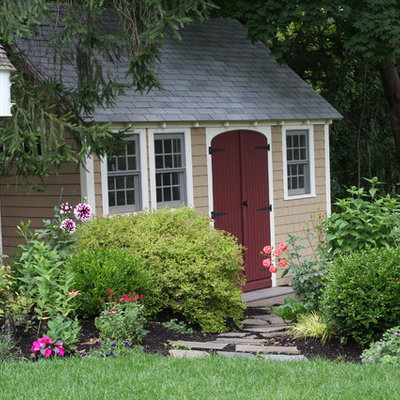 Photo of a large traditional full sun backyard stone landscaping in Boston for summer.