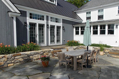 Inspiration for a huge timeless stone patio remodel in Burlington