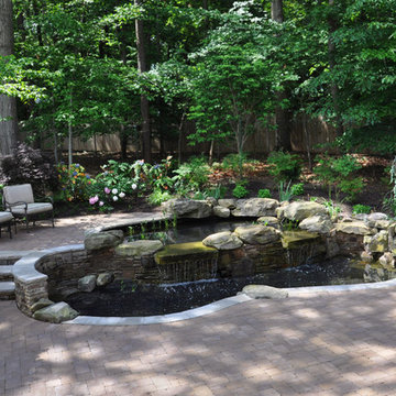 Two-tiered koi pond and paver patio