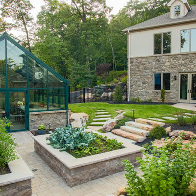 This is an example of a traditional full sun backyard vegetable garden landscape in Other.