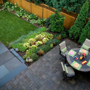 Design ideas for a traditional backyard stone vegetable garden landscape in Minneapolis.