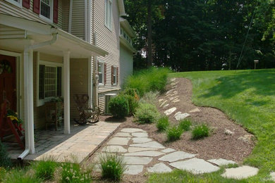 Inspiration for a mid-sized eclectic partial sun front yard concrete paver landscaping in New York.