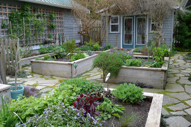 Design ideas for a small traditional full sun courtyard stone vegetable garden landscape in Seattle.