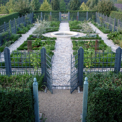 Photo of a large farmhouse backyard stone landscaping in New York.