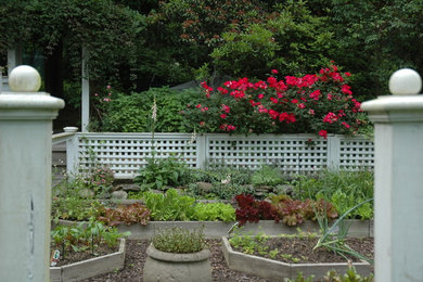 Inspiration for a large traditional partial sun backyard mulch formal garden in New York.