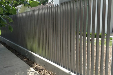 Verticle fence and Automatic gate and concrete retaining wall