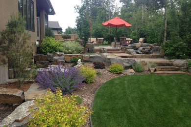 This is an example of a rustic drought-tolerant backyard stone garden path in Edmonton.