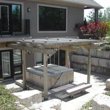 walk out w/hot tub/arbours/armour stone retaining