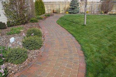 Design ideas for a medium sized back full sun garden in Boise with a garden path and brick paving.