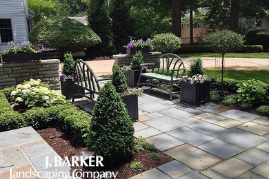 Medium sized traditional front full sun garden in Cleveland with a garden path and natural stone paving.