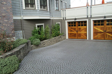 Photo of a medium sized classic front full sun garden in Seattle with a retaining wall and concrete paving.