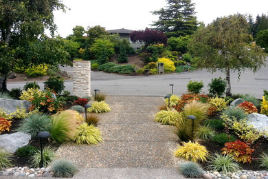Design ideas for a mid-sized asian full sun front yard concrete paver walkway in Seattle.