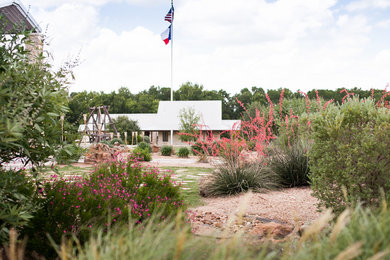 This is an example of a farmhouse landscaping in Houston.