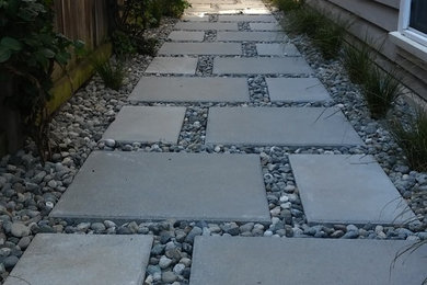 Design ideas for a traditional side garden in Seattle with concrete paving.