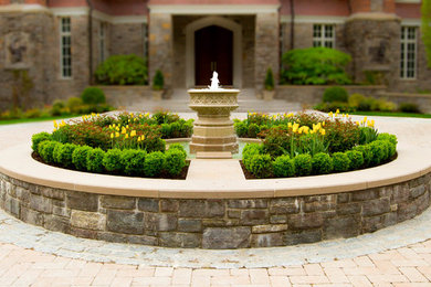 Photo of a huge traditional partial sun courtyard stone water fountain landscape in New York for summer.
