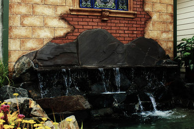 Water feature, decorative rock, & faux rock landscaping remodel