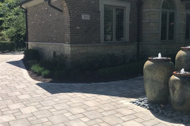 Photo of a large front yard brick water fountain landscape in Chicago.