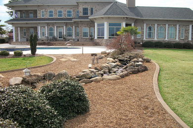 Design ideas for a full sun backyard landscaping in Charlotte.