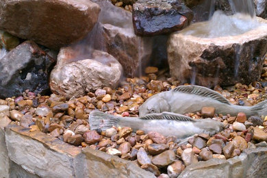 This is an example of a modern stone water fountain landscape in Austin.