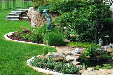 This is an example of a small traditional backyard landscaping in Wichita.