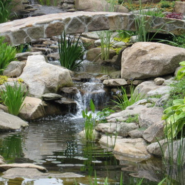 Water garden, backyard waterfall and bridge by Matthew Giampietro