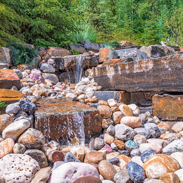Waterfall Water Feature With River Rock & Kootenay Brown Stone