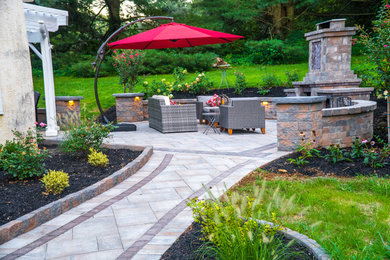 This is an example of a mid-sized transitional full sun backyard landscaping in Philadelphia.