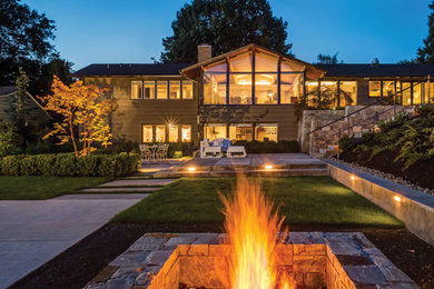Inspiration for a mid-sized contemporary backyard landscaping in Portland with a fire pit.