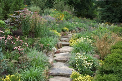 Design ideas for a contemporary full sun stone landscaping in New York for summer.