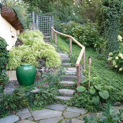 This is an example of an eclectic shade side yard stone landscaping in New York.