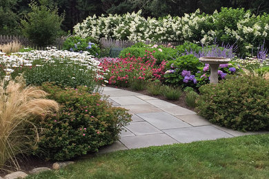 Photo of a small coastal drought-tolerant and full sun front yard stone garden path in Providence for summer.