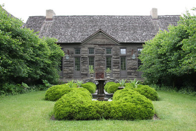 Photo of a large farmhouse courtyard stone landscaping in New York.