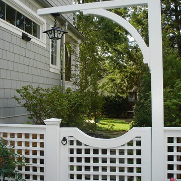 White Garden Gate with Hanging Iron Lamp