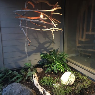 This is an example of a mid-sized contemporary shade backyard landscaping in San Francisco with decking.