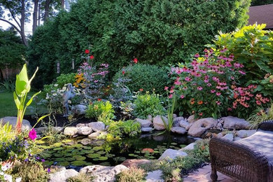 Photo of a traditional backyard water fountain landscape in New York.