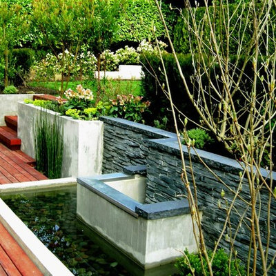 Photo of a contemporary retaining wall landscape in Vancouver.