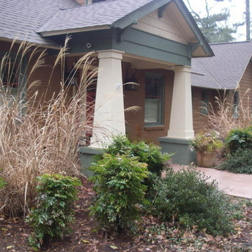 Winter view of the entrance. Plants and pots hide the wide french drain that run