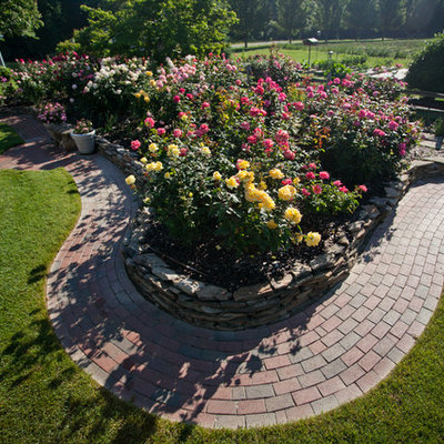 Design ideas for a large shabby-chic style full sun backyard stone formal garden in Raleigh.