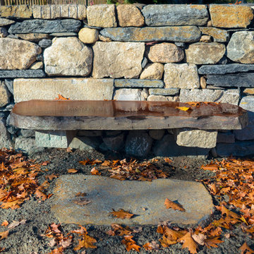 Wood and stone bench, dry laid stone wall