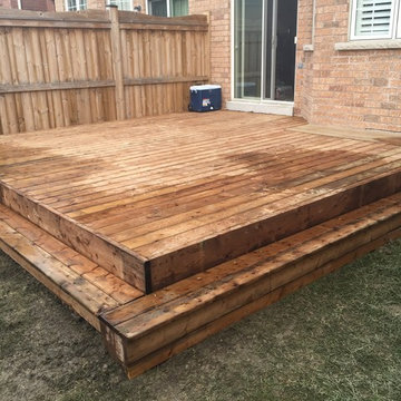 Wooden Patio with Walkway and Raised Garden